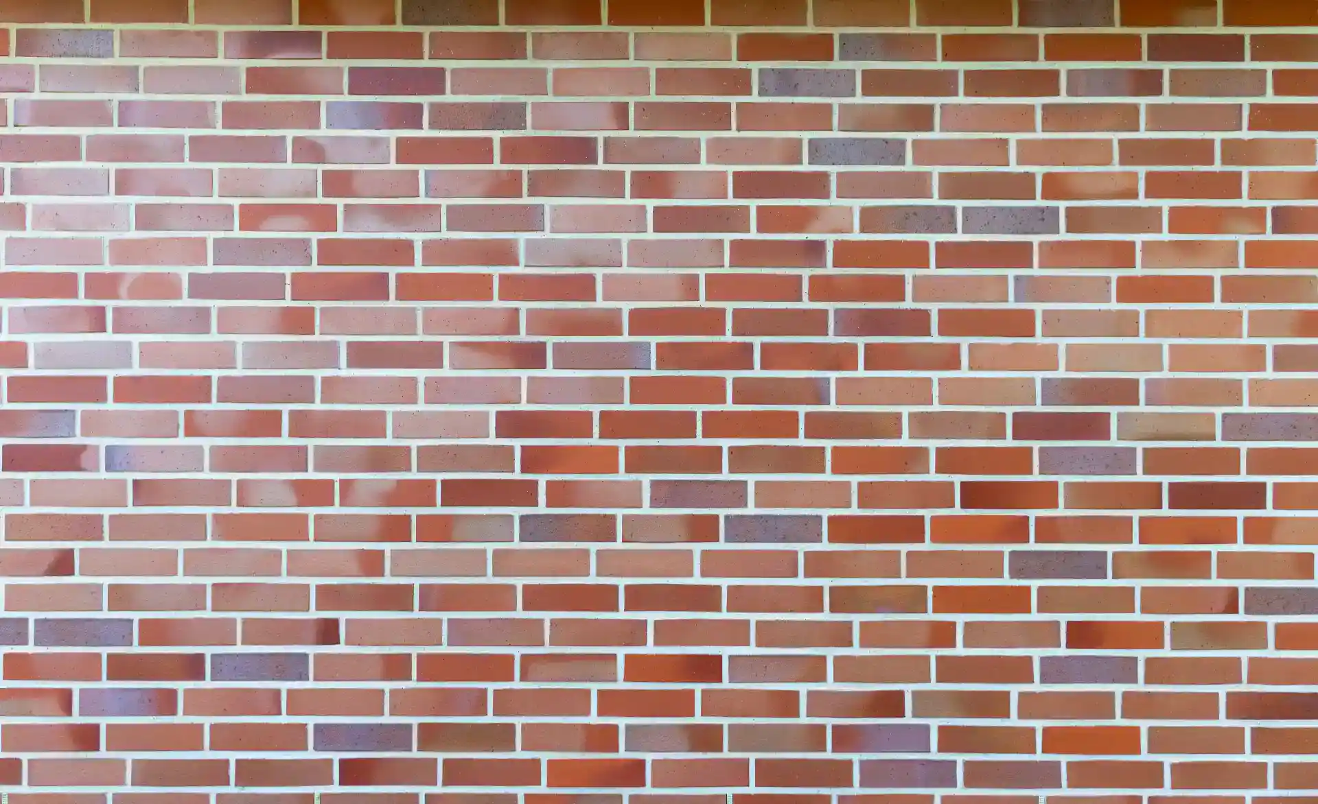 MURsten med røde og grå mursten i en ensartet mønster. Perfekt til facade eller indervægge.